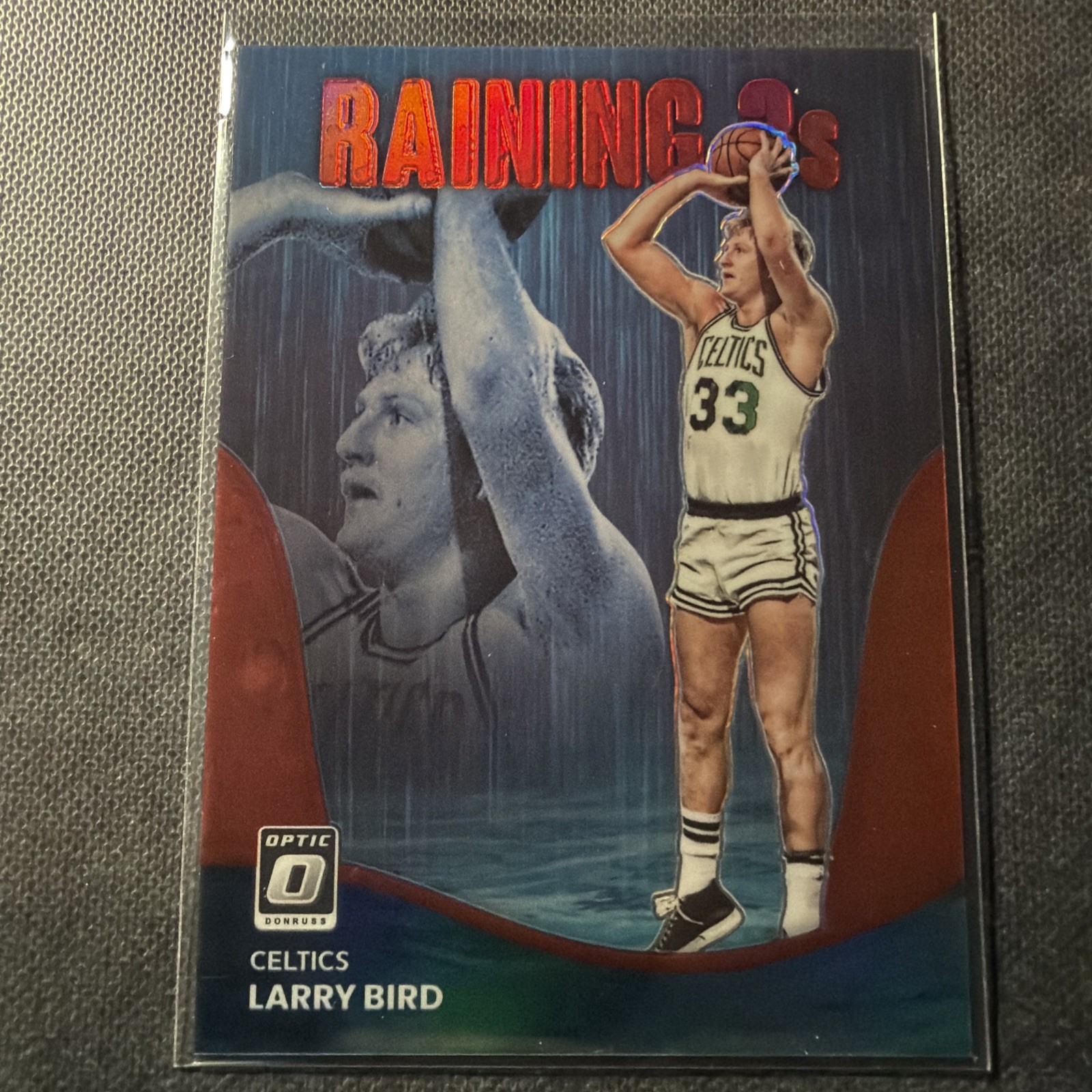 2022-23 Panini Donruss Optic Raining 3s Red Prizm 1/99 Larry Bird #18 HOF 