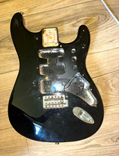 Black early 2000s MIM fender standard body w/ bridge and input jack plate