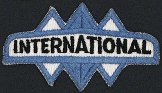Vintage uniform patch INTERNATIONAL truck die cut diamonds new old stock n mint