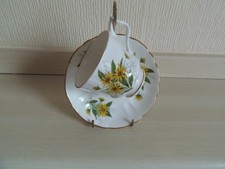 Royal Arden bone china Coffee Cup and Saucer with a yellow daisy like flower