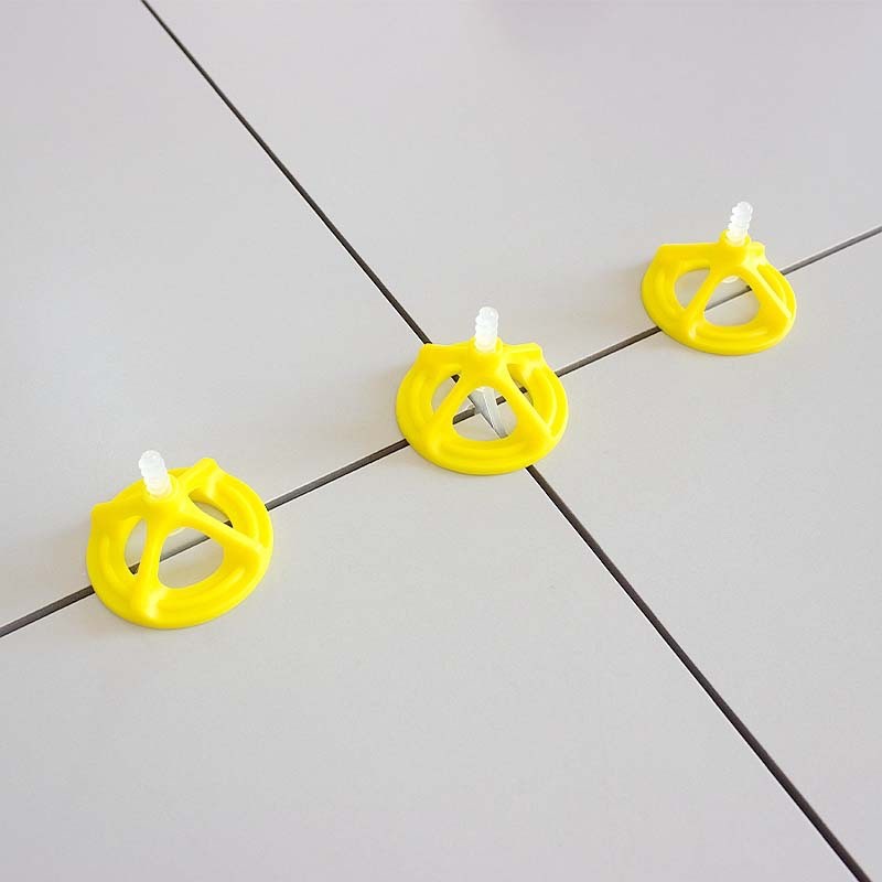 Sistema de nivelación de azulejos con tapones giratorios y lengüetas roscadas juego pestañas clips