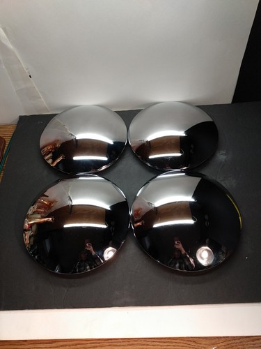 Baby Moon" Center Caps which are a style of wheel cover For Older Vintage Cars