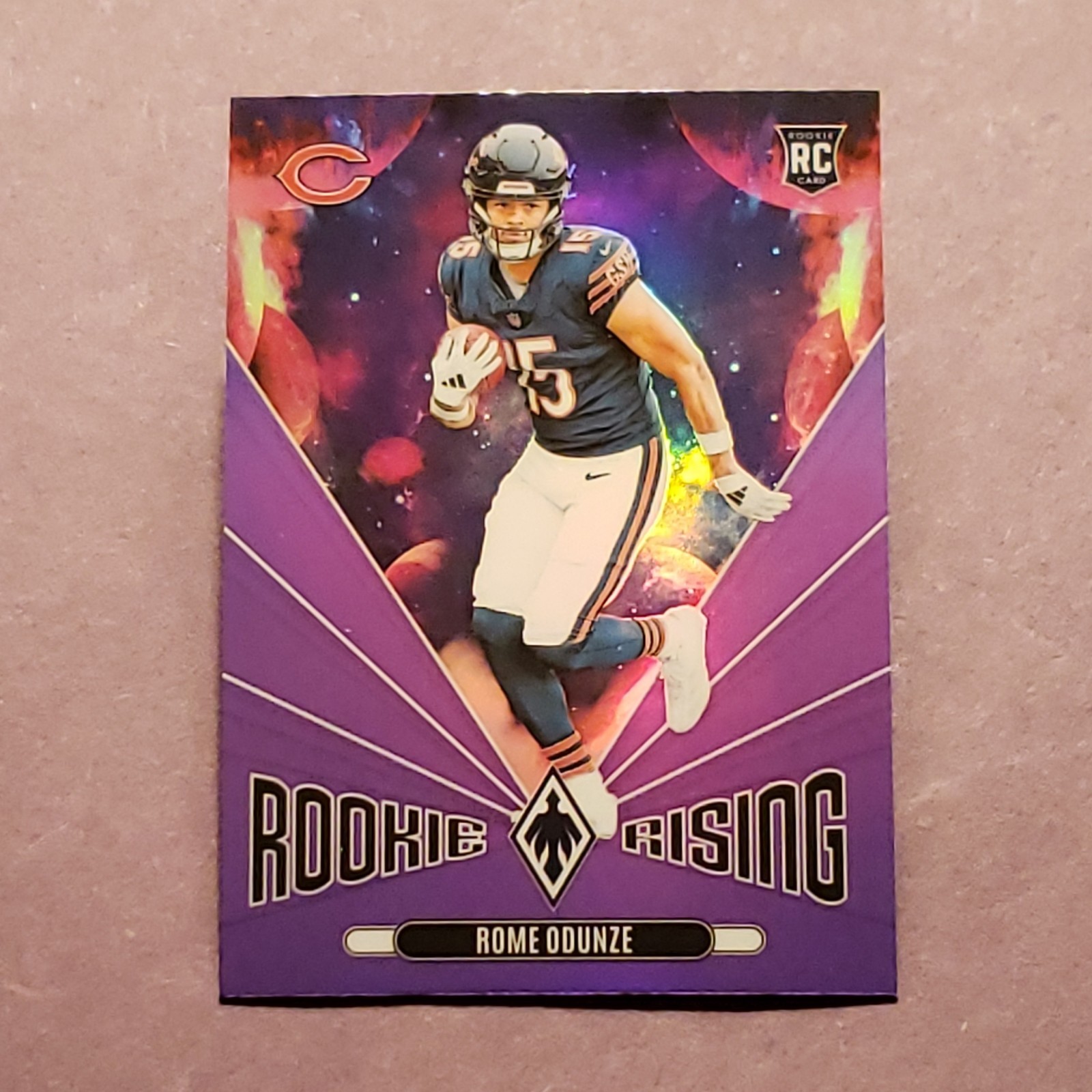 2024 Panini Phoenix - Rookie Rising Rome Odunze #RR-ROE Purple (RC)