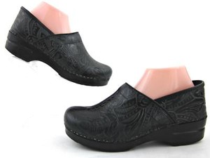 dansko tooled leather clogs
