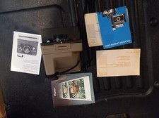 Vintage Polaroid Pronto/5M Camera with owner manual and instruction on care