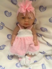 Baby Doll in white And pink dress And shoes