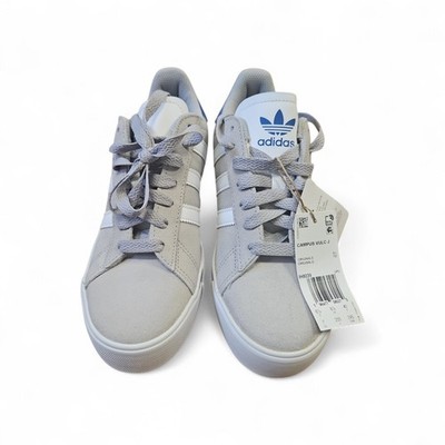 Adidas Campus Vulc J sneakers in a grey colorway with blue accents.