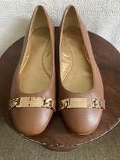 Tan leather Coach ballet flats with gold chain Coach