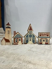 Set of 4 Wooden Decorative Village Buildings – Lighthouse, House, Church, Store