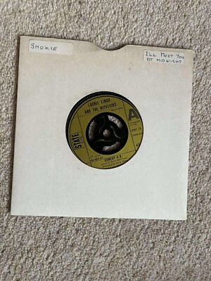 LAURIE LINGO AND THE DIPSTICKS - ROCK IS DEAD/CONVOY G.B. - 7'' VINYL W PAPER SLV