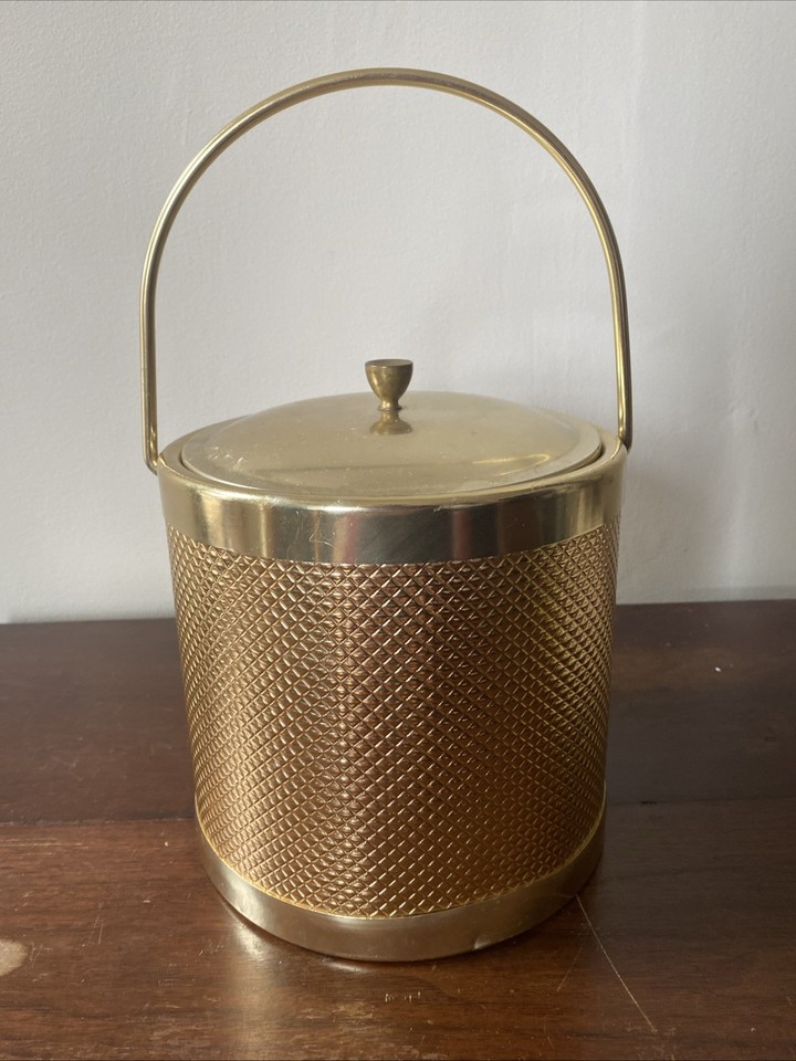 Italian-made gold diamond-weave metal ice bucket with that unmistakable 60s continental flair.