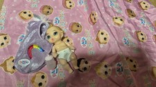 Zapf creation Babyborn suprise doll rainbow with swaddle wrap and bottle.
