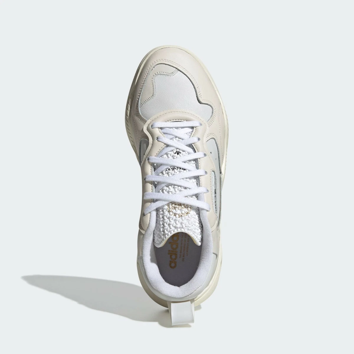Adidas falcon hotsell white mens