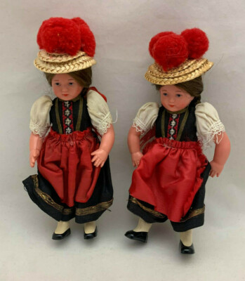 Pair Decorative Dolls with hats and red pompoms -hard plastic with cloth costume