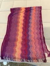 Missoni scarf with zigzag stripes in shades of purple, orange, and red