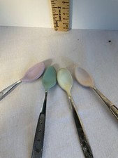 Three Munchkin Baby spoons one additional spoon with giraffe stainless/rubber