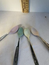 Three Munchkin Baby spoons one additional spoon with giraffe stainless/rubber