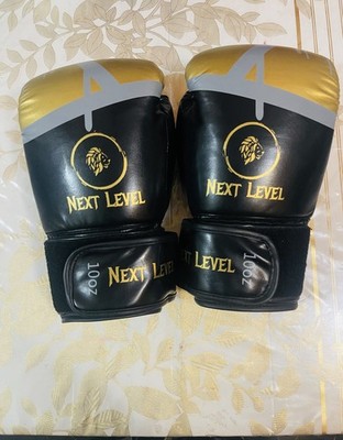 Next Level boxing gloves Black and gold color Lion Logo 10 Oz