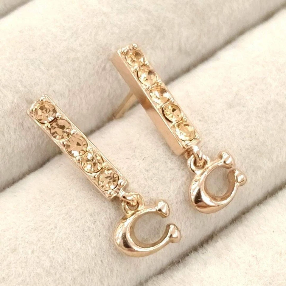 Excellentes ++ boucles d'oreilles COACH en or rose avec pierres - Photo 2/4