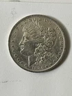 Morgan Silver Dollar 1884 O, Almost Uncirculated