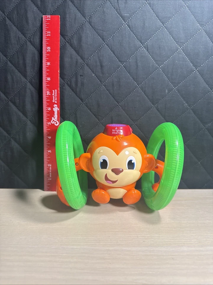 Bright Starts Roll and Glow Mono Bebé Juguete Jugar para Aprender Funciona Naranja y Verde Foto 2 de 4