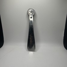 Vintage shoehorn featuring the Chrysler symbol