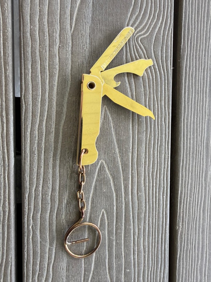 A compact vintage folding multi-tool with a magnetic twist — file, blade, bottle opener, and keychain carry in one retro EDC package.