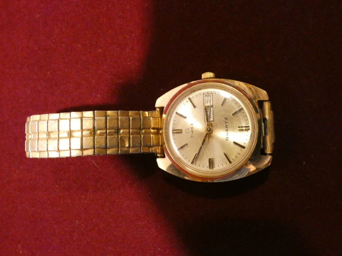 Reloj vintage para hombre Timex estuche en tono dorado banda el stica SOLO PIEZAS