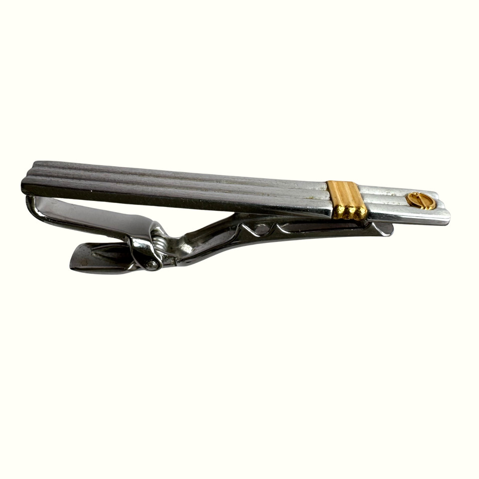 A genuine Dunhill silver and gold-tone tie bar — understated designer heritage that costs a fraction of retail on the secondhand market.
