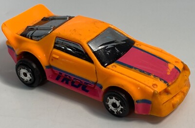 COLLECTABLE MODEL CAR MATCHBOX BURNIN KEY 1986 IROC CAMARO ORANGE (WHEEL BENT)