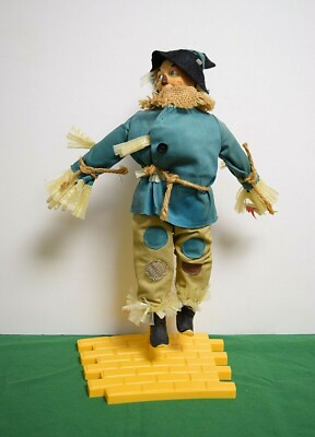 Wizard of Oz Vintage Collectible Scarecrow with yellow brick road stand. P3801