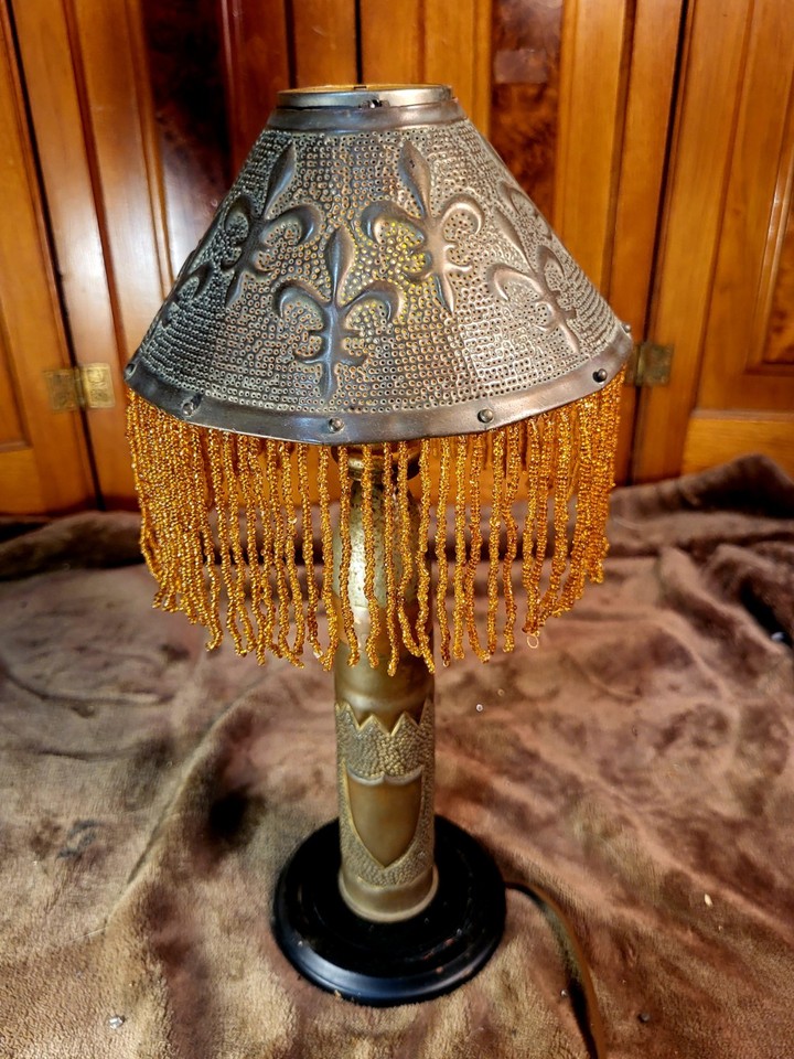 A handmade brass lamp crafted from WWI/WWII artillery shell casings — trench art is one of the most fascinating folk-art categories and this is a desk showstopper.