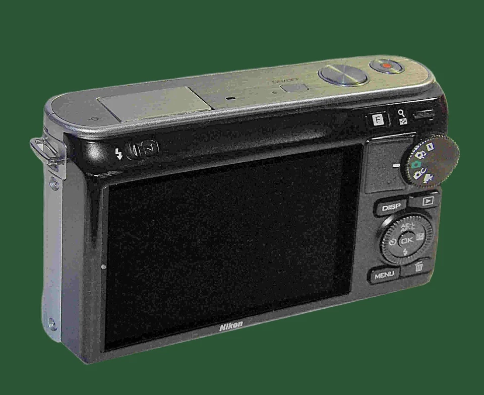 NIKON j1 (plateado) - puerta de batería NO se cierra Foto 2 de 4