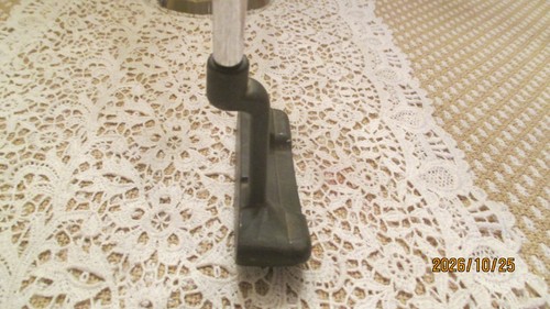 Black vintage PING Anser putter head with silver shaft on beige lace doily, marked “2026/10/25 Made in USA.”