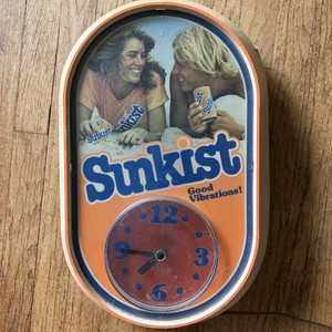 Vintage 1970s-1980s Sunkissed Good Vibrations Lighted plug in Wall Clock.