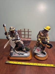 (2) VANMARK RED HATS OF COURAGE SHATTER FIREMAN FIGURINE & PUSHING FORWARD