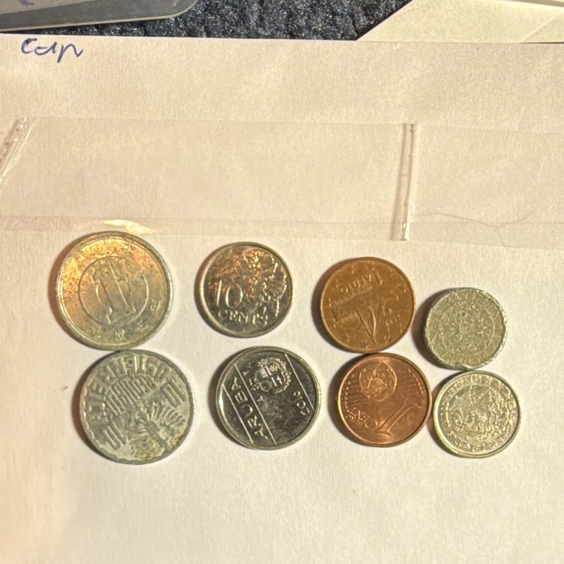 Lot of eight world coins ￼