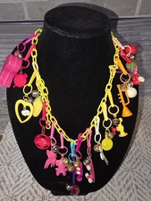 Vintage/Retro 1980's Clip on Plastic Bell Charm Necklace with 19 charms