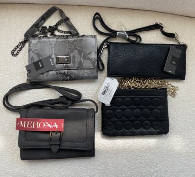 Four small crossbody handbags.