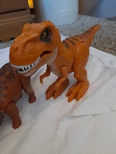 ZURU INC TOY TYRANNOSAURUS T REX Orange DINOSAUR GLOW WOUND. JP Dinos. Tri/Blue