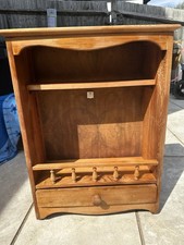 Vintage wall Wood display cabinet with a shelf and a lower storage drawer.