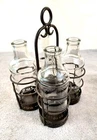 Vintage 10"x6" Wrought Iron Holder Tea Candle Holder 7" Glass Milk Bottles 4 gif