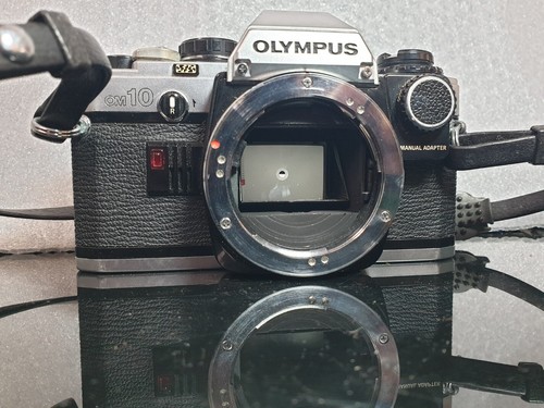 Olympus OM10 SLR Vintage Film Camera con ZUIKO AUTO S 50mm-teleplus-Kenko - Imagen 19 de 24