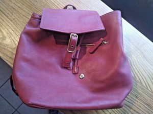red and brown coach backpack