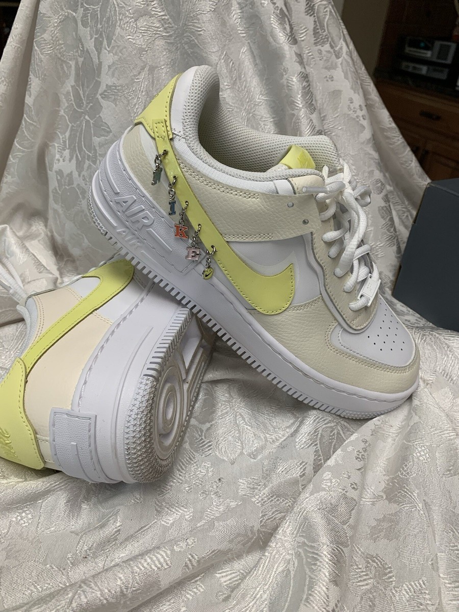 yellow air max with charms