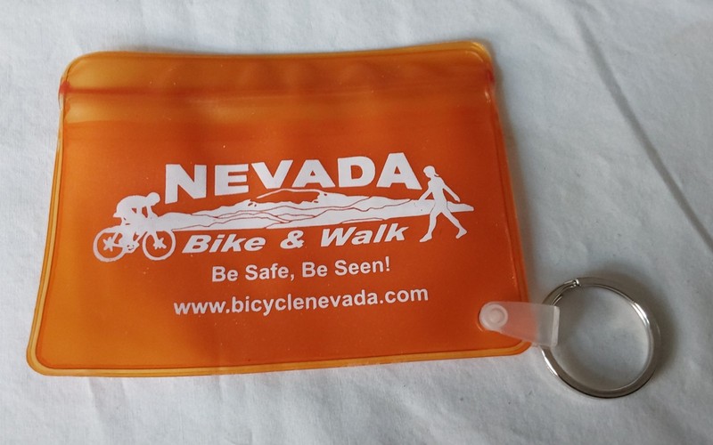NICE KEYCHAIN WITH SEALABLE POUCH FOR ID ETC.    NEVADA BIKE & WALK