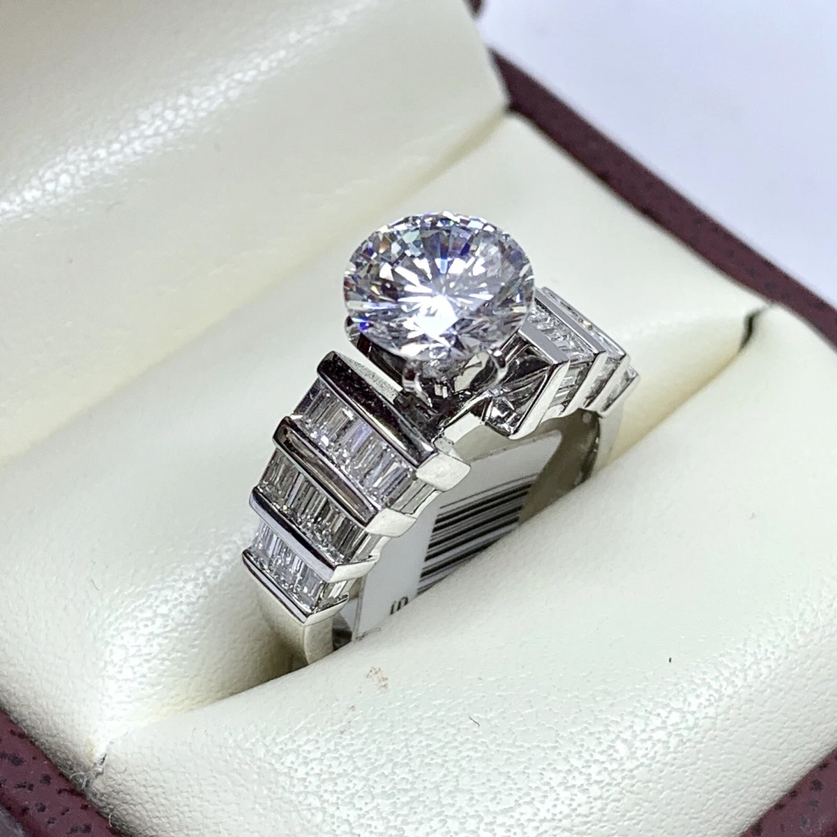 Gold baguette hotsell engagement ring