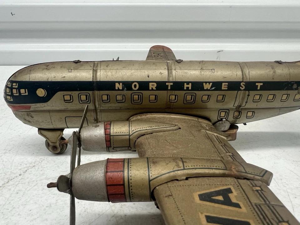 Avión de juguete de hojalata vintage Tin NW Airlines NWA Japón cuerda Northwest Airlines Foto 2 de 4
