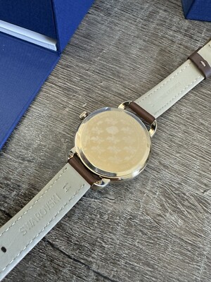 New In Box Swarovski Aila Day Brown Yellow Gold-Tone Ladies Watch