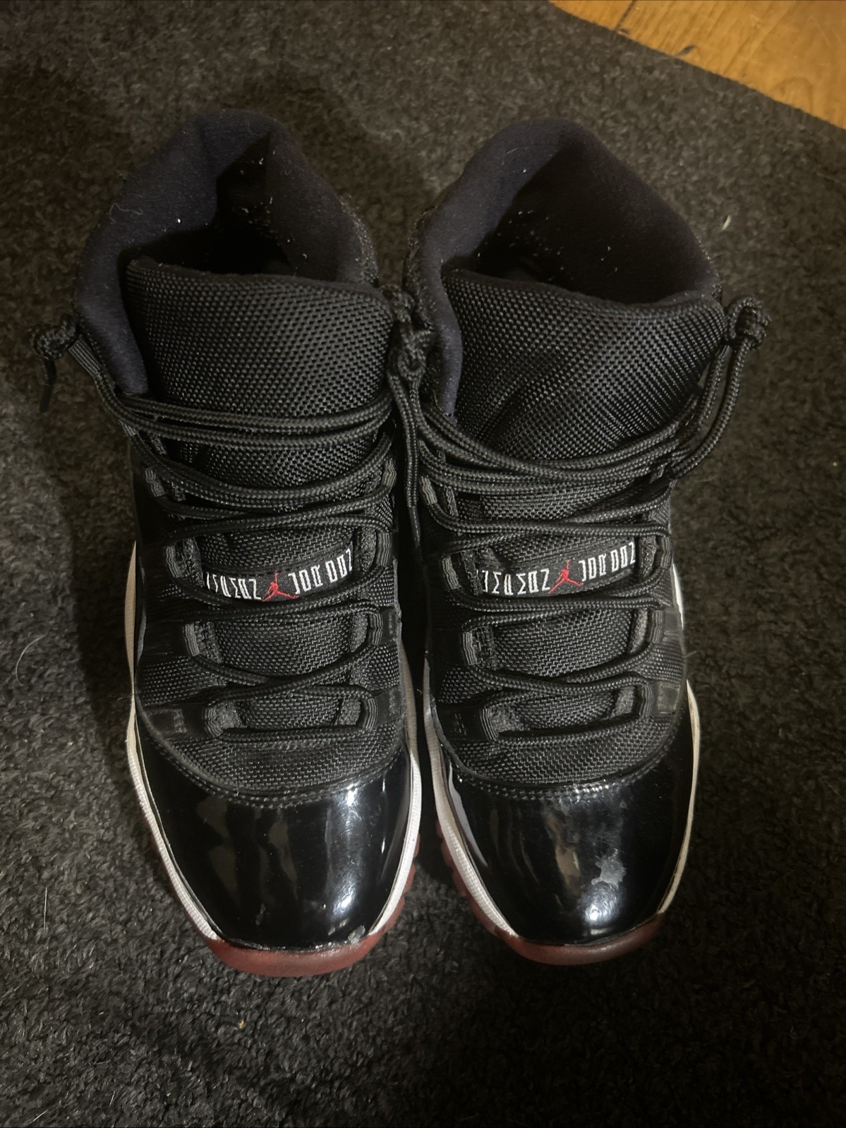 Air Jordan 11 Retro Bred Men's Black and Red High Top Sneakers